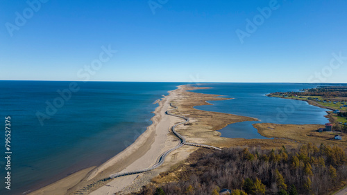 Aerial Drone View Of A Beautiful Beach and Boardwalk On The Coast Of The Atlantic Ocean in Bouctouche  New Brunswick  Canada