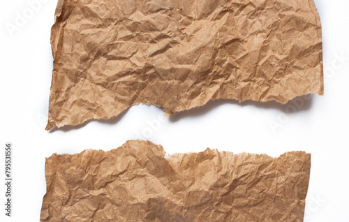 Crumpled brown paper. Background made of natural paper with tears on a white background
