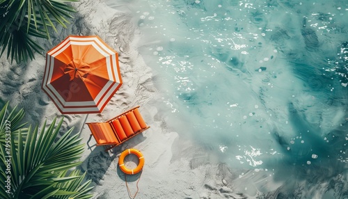 Summer time beach vibes decorated with beach umbrella, chair and rubber ring