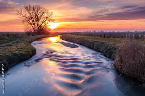 Serene river flowing gently through a peaceful countryside at sunset
