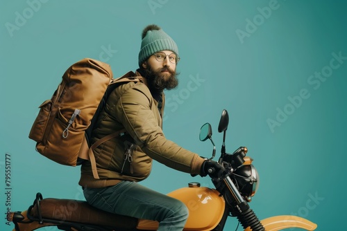Motorcyclist with backpack on a scooter photo