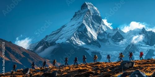 Group of Hikers Trekking Across Rugged Terrain Toward a Majestic Snow-Capped Mountain, Embodying the Spirit of Adventure and Exploration photo