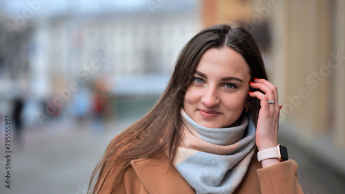 Portrait of a Slavic girl in the city in the cold season.