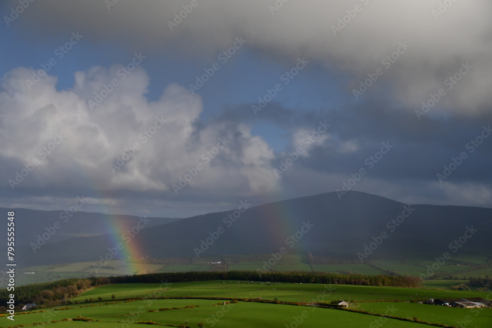 View of rainbow over tne mountains. Coppanagh Hill, Co. Kilkenny, Ireland View of rainbow over tne mountains. Coppanagh Hill, Co. Kilkenny, Ireland