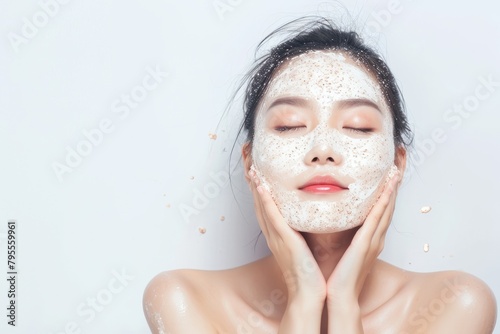 The picture of the asian woman using the cream treatment, the young beautiful girl has been using facial treatment for skin care of her face, the white lady facial treatment for the moisture. AIGX01.