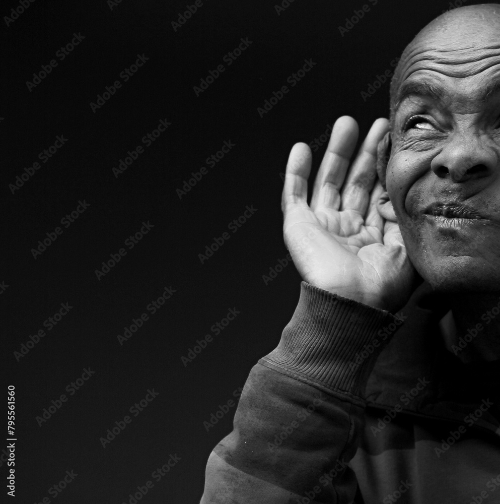 deaf man suffering from deafness and hearing loss on grey background with people stock photo deaf man suffering from deafness and hearing loss on grey background with people stock photo
