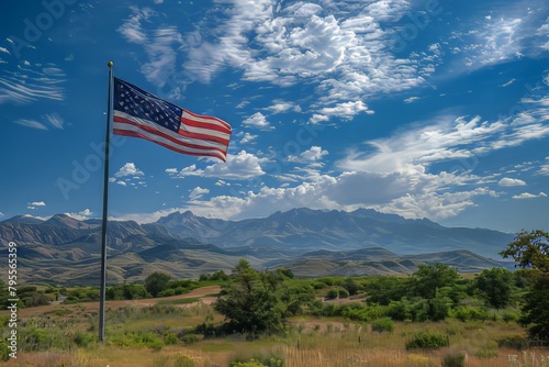 American flag on a pole against a mountain landscape