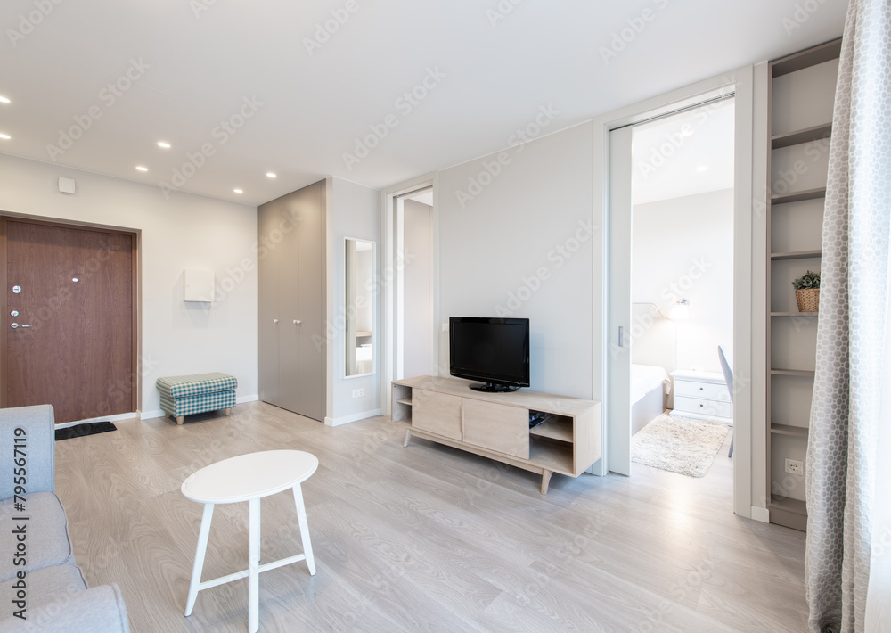 Modern Living Room Interior with Open TV Area and TV on the Wooden Desk, Sofa, And Coffee Table Modern Living Room Interior with Open TV Area and TV on the Wooden Desk, Sofa, And Coffee Table