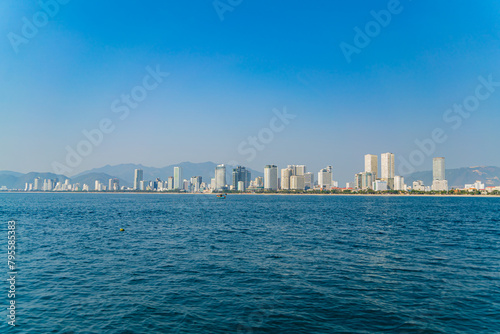 The city is from a distance from the sea. Nha Trang city in Vietnam. View of the city from the sea.