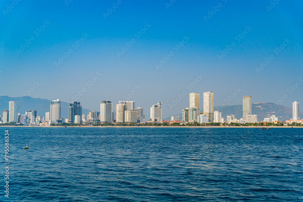 The city is from a distance from the sea.
Nha Trang city in Vietnam. View of the city from the sea.