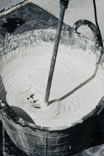 Close-up of mixing cements with the smooth texura mixer.
