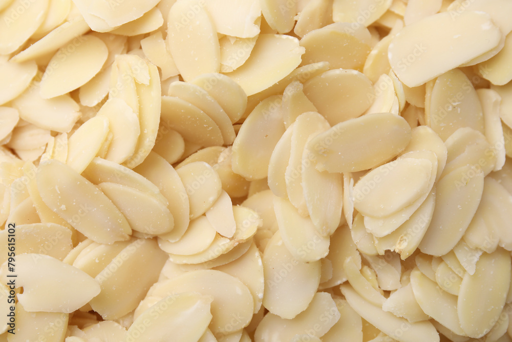 Fresh almond flakes as background, top view Fresh almond flakes as background, top view
