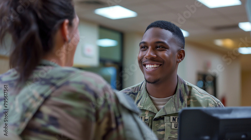 In a welcoming reception area, a man smiles as he discusses enlistment options with an enthusiastic recruiter, the scene reflective of the transformative journey ahead.