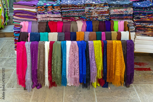 Colorful fashion stylish scarves sold outside on a market © Tatty