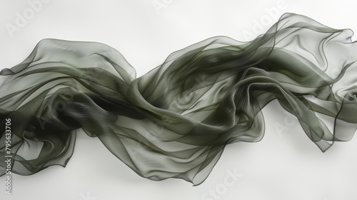  A monochrome image of a lengthy, flowing fabric sheet against a white backdrop, surrounded by an unadorned white wall