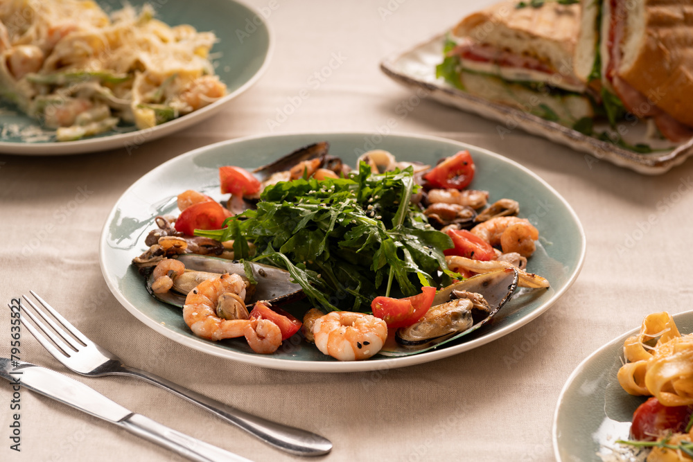 seafood salad with shrimp, mussels, squid and other ingredients. keto diet seafood salad with shrimp, mussels, squid and other ingredients. keto diet