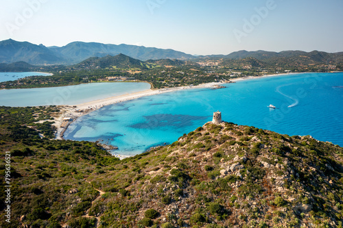 Aerial shot of tranquil Sardinian bay with watchtower photo