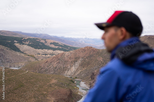 Mountain scenery in northern Neuquén, Patagonia Argentina with a male tourist out of focus in the foreground. © Lautaro