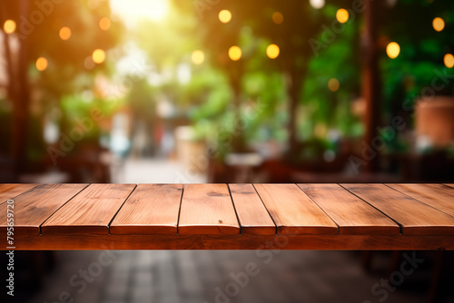 Empty wooden table in front of abstract blurred street bar background for product display in a coffee shop, local market or bar