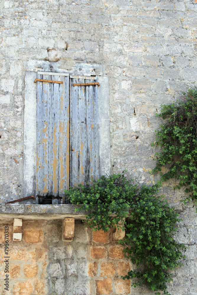 ancient window in Stari Grad on the island Hvar, Croatia
ancient window in Stari Grad on the island Hvar, Croatia