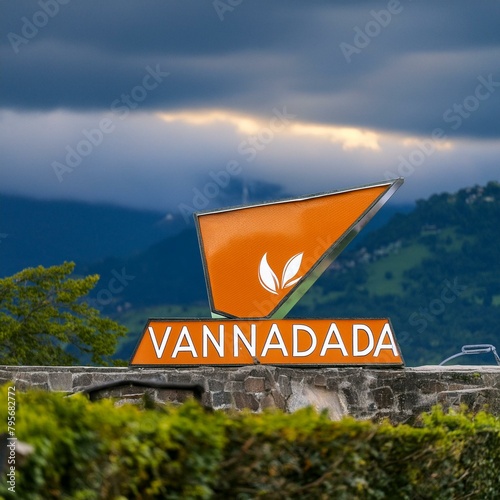 It is a VANADA COFFEE brand, and the color of the front signboard is orange that protrudes in a three-dimensional triangle, and a large DID and kiosk are installed at the top of the store. photo