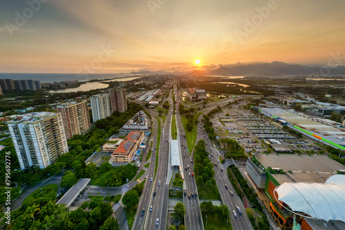 Aerial View of Americas Avenue, Alvorada Bus Terminal, and Cidade das Artes Cultural Complex in Rio de Janeiro on Sunset