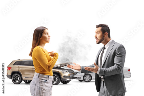 Fototapeta Naklejka Na Ścianę i Meble -  Businessman shouting at a young female after a car accident