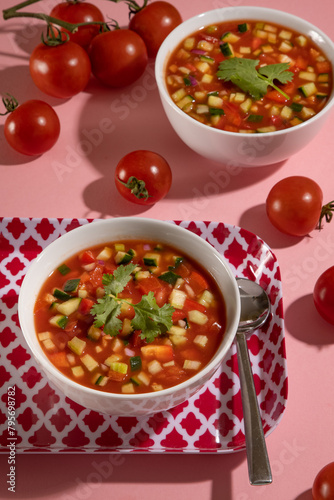 Overhead view of two bowls of gazpach photo