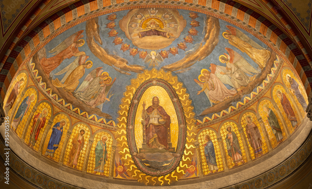 MILAN, ITALY - MARCH 6, 2024: The Christ the Pantokrator among the Apostles and angels in the main apse of the church Basilica di San Babila by Mario Albertella (1924 - 1925).