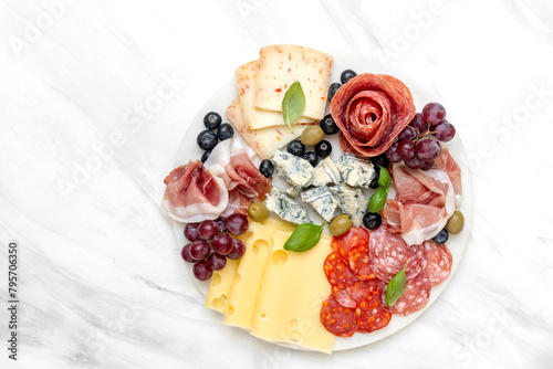 Italian food antipasto prosciutto ham, salami, olives and grissini breadsticks. cheese on a board parmesan, pecorino, gorgonzola. Charcuterie board. elegant serving, banquet cold meat plate