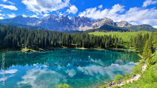 Italy Idyllic nature scenery- trasparent mountain lake Carezza surrounded by Dolomites rocks- one of the most beautiful lakes of Alps. South Tyrol region. 