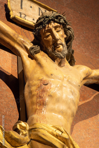MILAN, ITALY - MARCH 6, 2024: The detail of carved polychrome Crucifixion in the church Basilica di San Babila by unknown artist. 