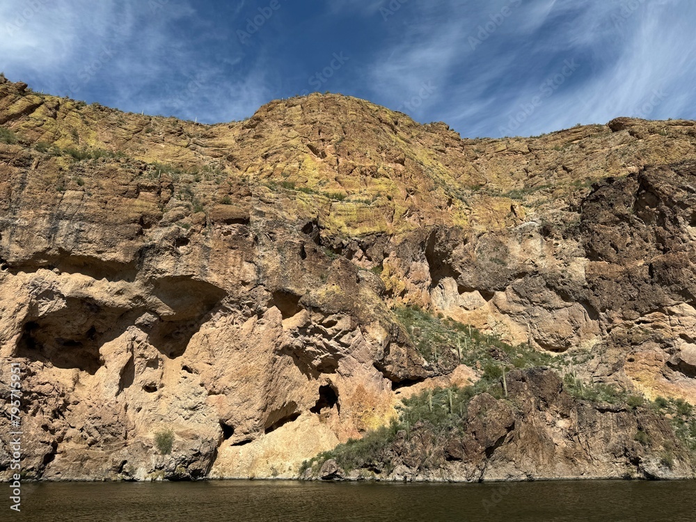View from a steamboat, of Canyon Lake reservoir and rock formations in Maricopa County, Arizona in the Superstition Wilderness of Tonto National Forest near Apache Trail.  The lake was formed by dammi