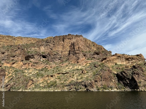 View from a steamboat, of Canyon Lake reservoir and rock formations in Maricopa County, Arizona in the Superstition Wilderness of Tonto National Forest near Apache Trail.  The lake was formed by dammi photo