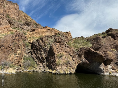 View from a steamboat, of Canyon Lake reservoir and rock formations in Maricopa County, Arizona in the Superstition Wilderness of Tonto National Forest near Apache Trail.  The lake was formed by dammi photo