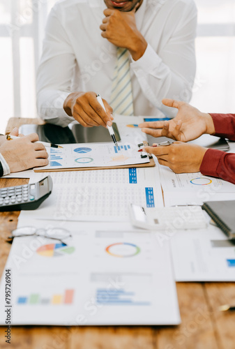 Corporate business people working in busy marketing office space, planning strategy in books and reading email on laptop at work, workers at startup advertising company