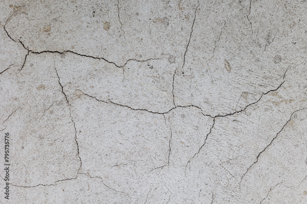 Fototapeta premium Textures of old concrete. Gray damaged concrete background, wall, old slabs. Top view, close-up.