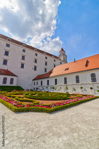 Beautiful flower garden behind the castle with the tower in the middle, Bratislava, Slovakia