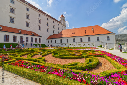 Beautiful and colorful baroque gardens being captured by tourists, Bratislava, Slovakia