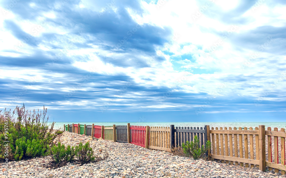 a colorful wooden grille facing the sea