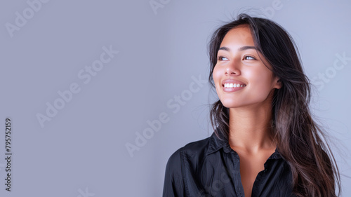 Side view of Indian businesswoman wearing black shirt, smiling candid