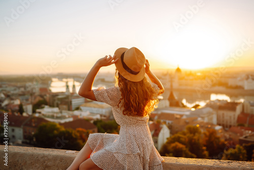 Photography Young girl tourist exploring new city at summer at sunset
