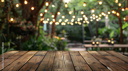 Rustic wooden table with blurred decorative lights, perfect for showcasing products