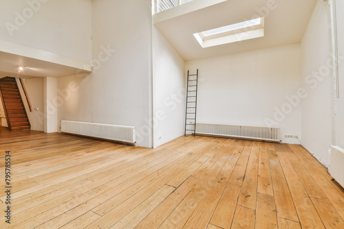 Wallpaper Mural Spacious unfurnished room with wooden floor and skylight Torontodigital.ca