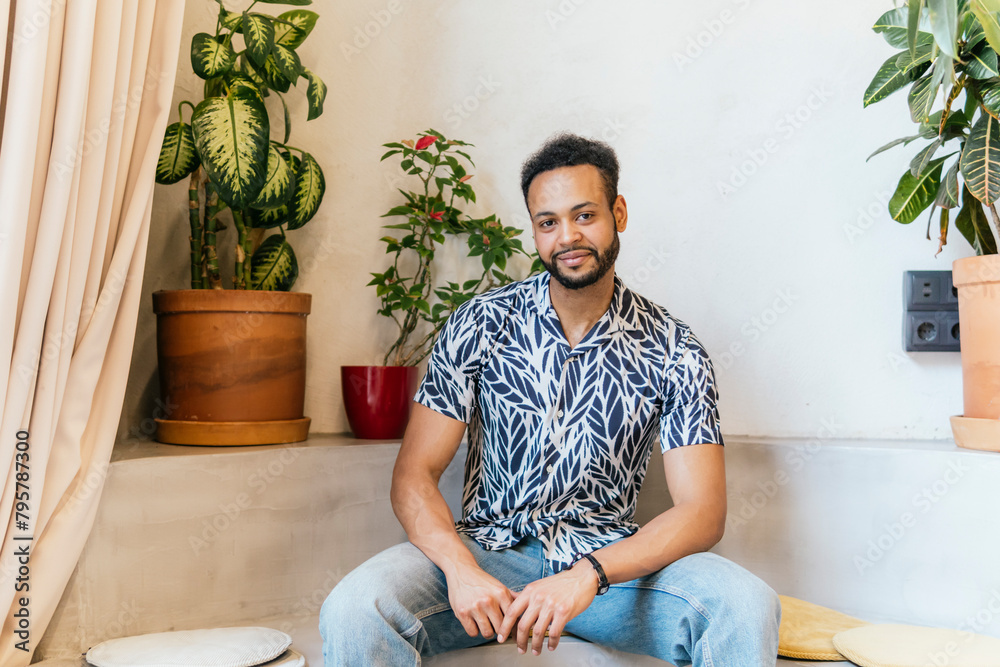 Casual Man Smiling in a Comfortable Coworking Space Casual Man Smiling in a Comfortable Coworking Space