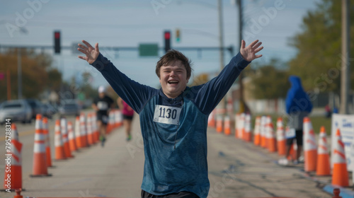 Victorious young athlete with down syndrome celebrates at the finish line