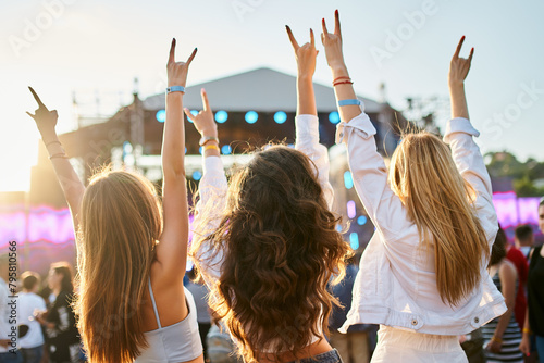 Wallpaper Mural Group of female friends enjoying live music on sunny beach festival. Girls dance, celebrate with hands up in summer vibe. Casual fun, youth culture, outdoor event by sea. Friendship, lifestyle moment. Torontodigital.ca