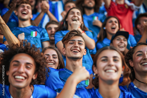 Italian football soccer fans in a stadium supporting the national team, Squadra Azzurra  © PixelGallery