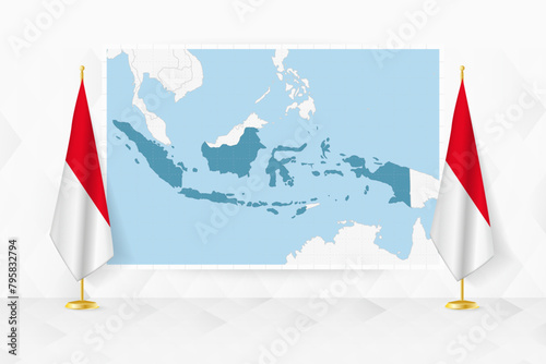Map of Indonesia and flags of Indonesia on flag stand.