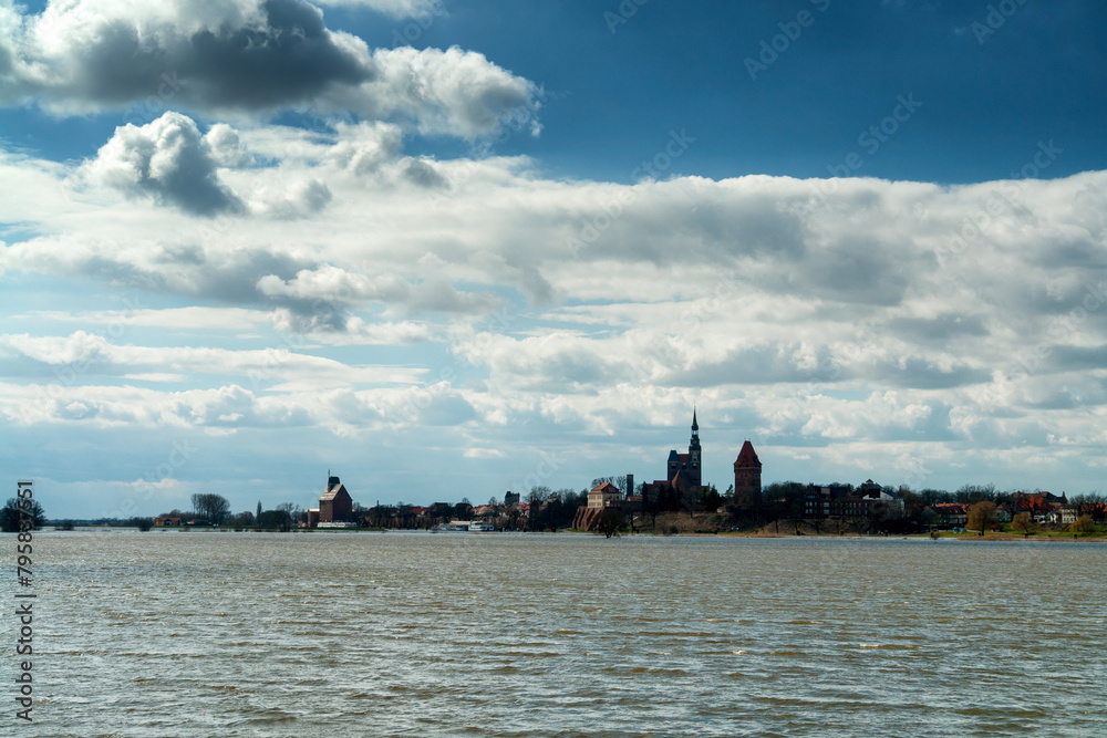 The swollen River Elbe near Tangermünde, Germany, floods its banks, depicting the raw power of nature in a scene of both awe and danger. The swollen River Elbe near Tangermünde, Germany, floods its banks, depicting the raw power of nature in a scene of both awe and danger.